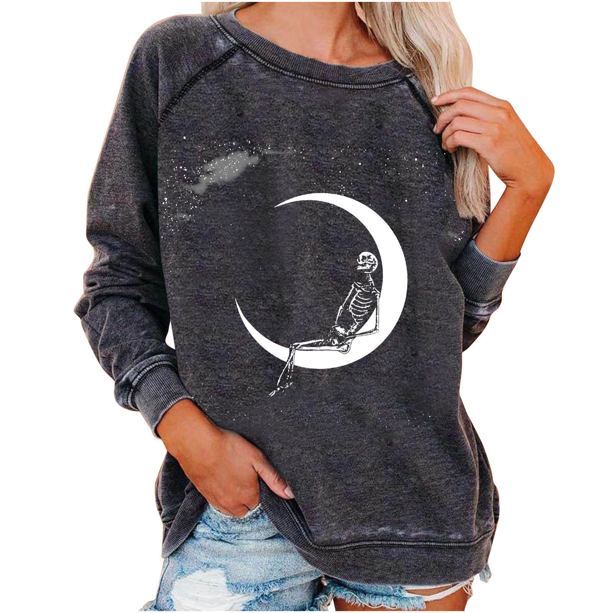 Dark gray sweatshirt with skeleton and moon design worn by a person on a white background