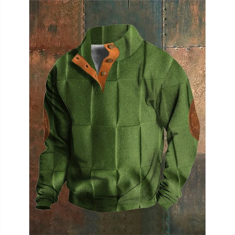 Green fleece pullover with brown collar on a textured wooden background