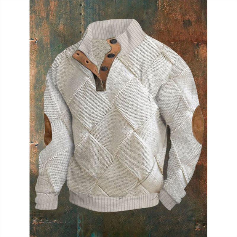 White textured sweater with brown leather patch on a rustic wooden background