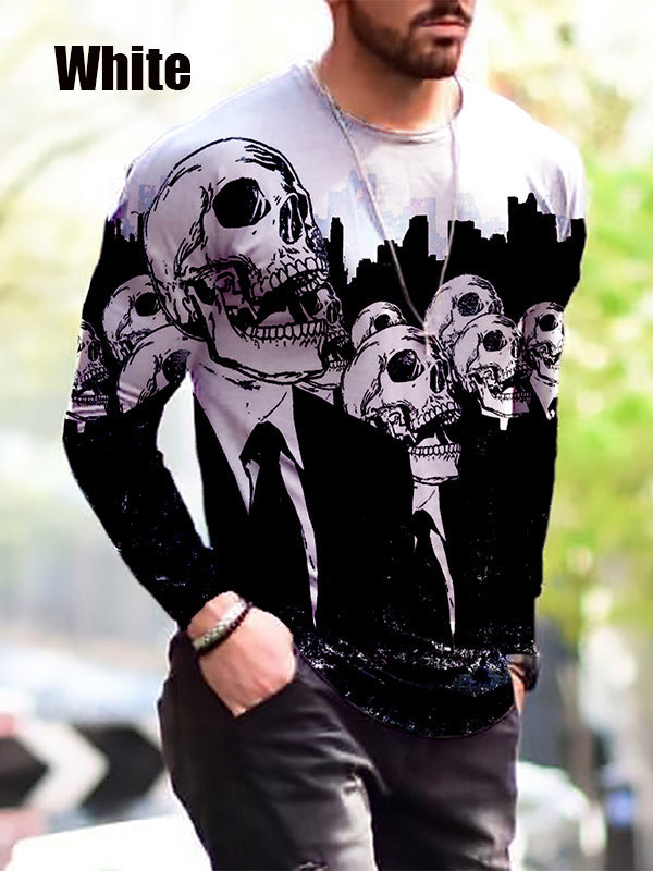 Person wearing a white long-sleeve shirt with black skull design in an urban setting
