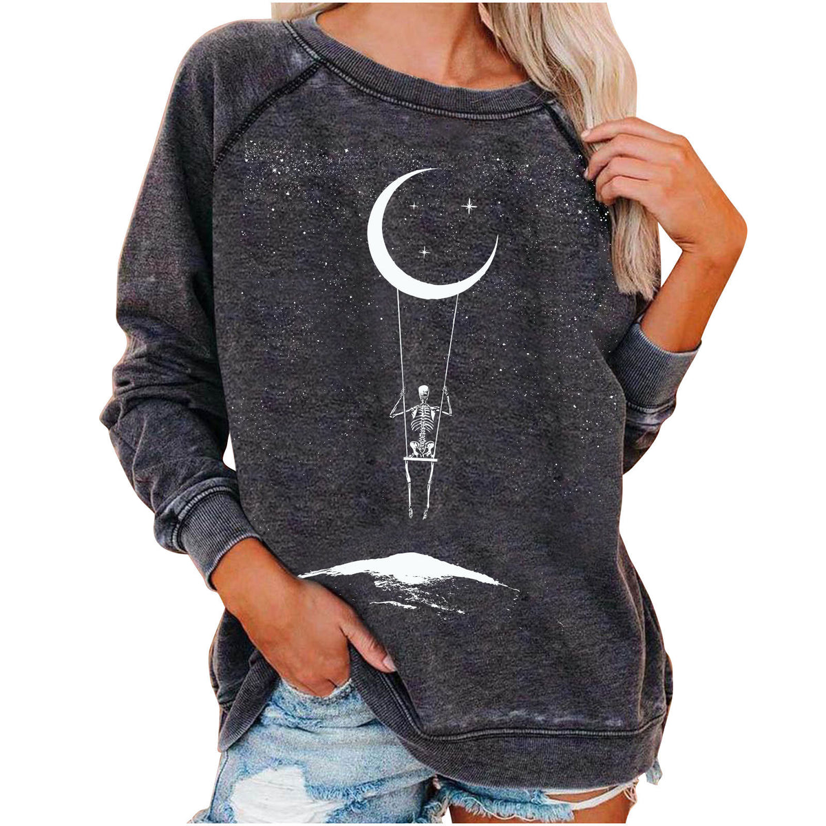 Dark gray sweatshirt with skeleton and moon design worn by a person on a white background