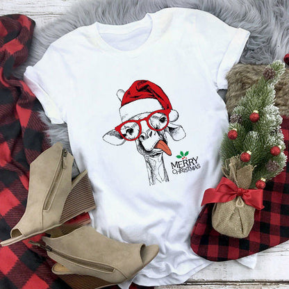 White t-shirt with a Christmas-themed design featuring a dog wearing a Santa hat and glasses, surrounded by festive items on a checkered fabric background.