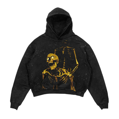 Black hoodie with a gold skeleton design on a white background