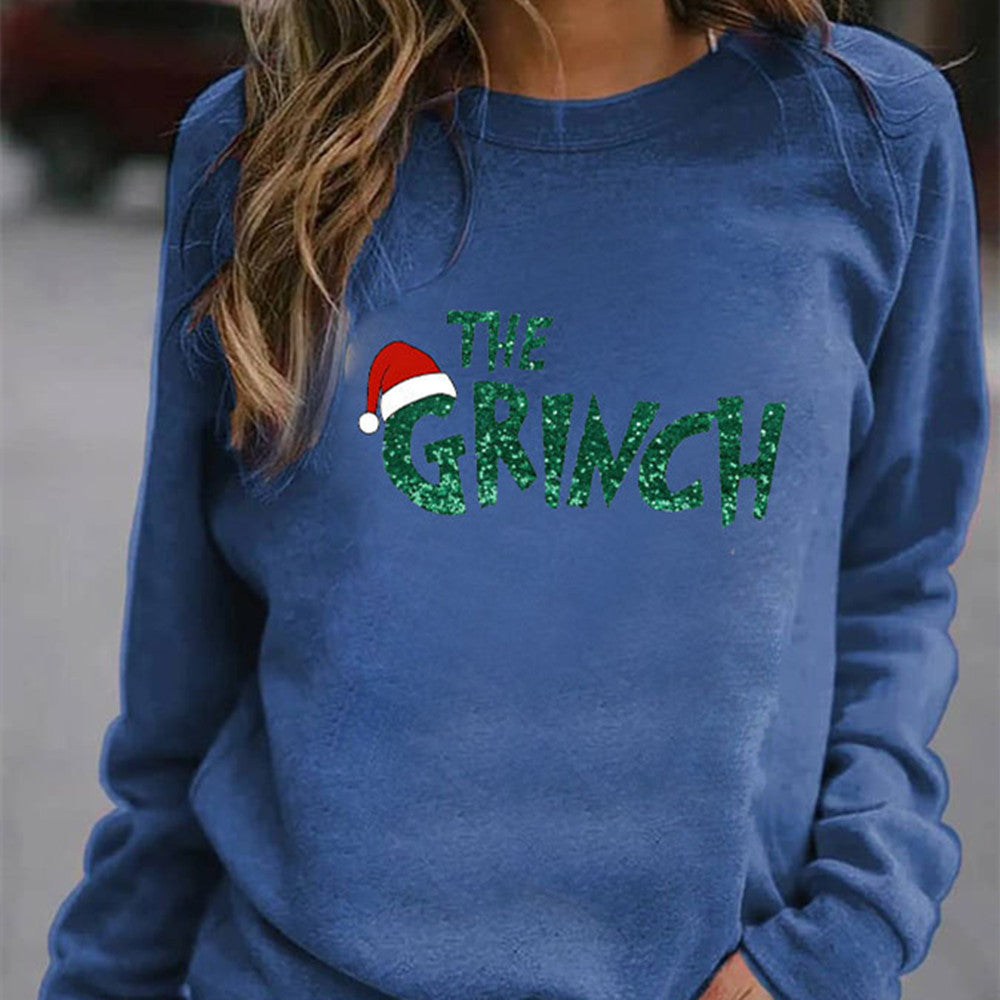 Blue sweatshirt with 'The Grinch' text and a red Santa hat graphic.