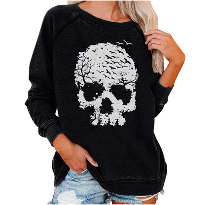 Black sweatshirt with a white skull design worn by a person on a white background