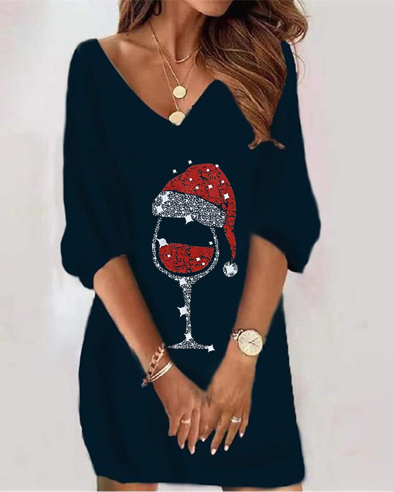 Navy blue dress with a wine glass and Santa hat design on a plain background