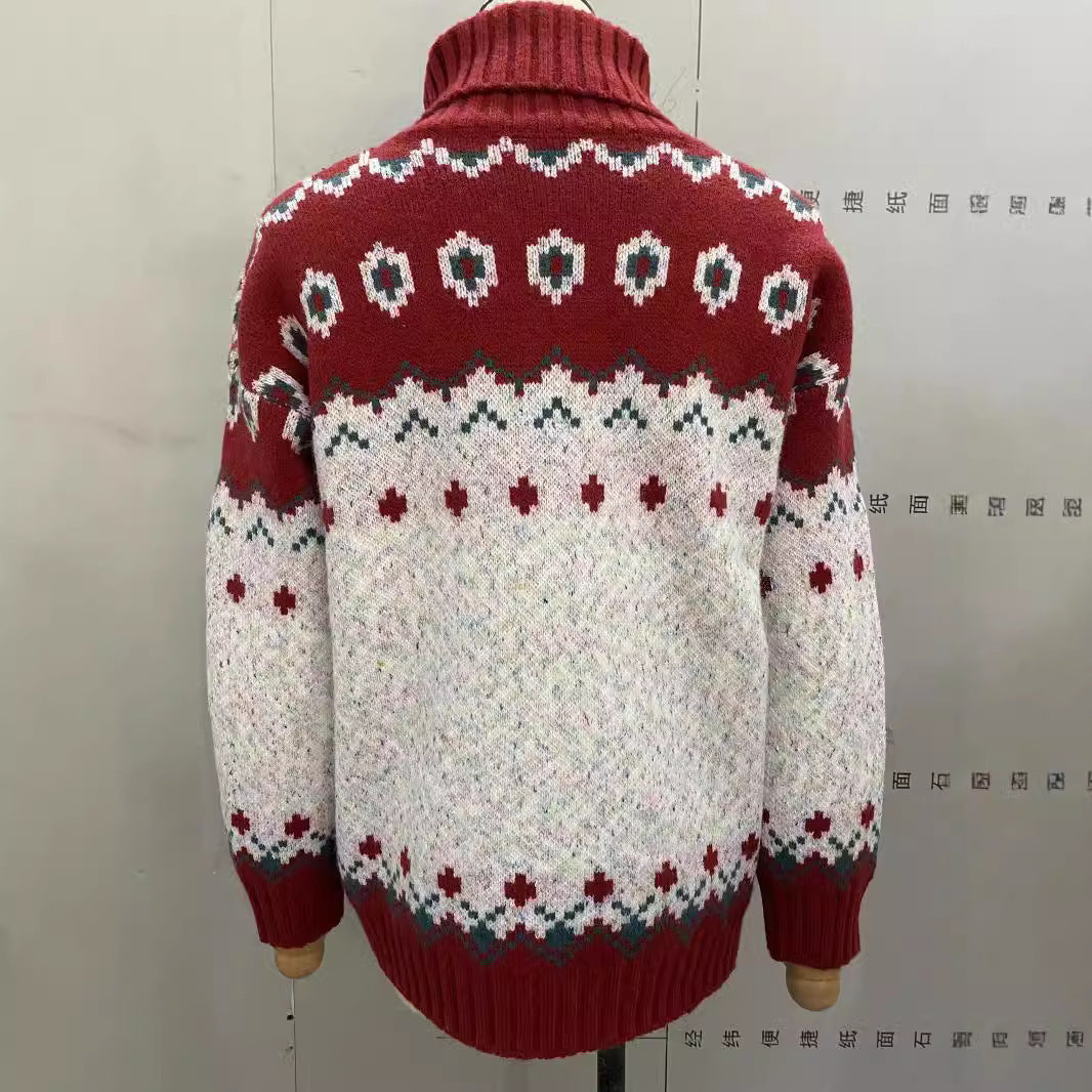 Red and white patterned sweater on a mannequin against a plain background
