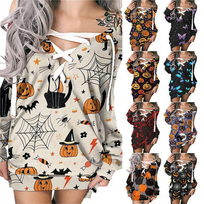 Halloween-themed dresses with pumpkins, ghosts, and spiders on a white background.
