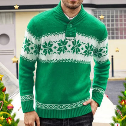 Person wearing a green sweater with white snowflake pattern in front of Christmas trees.