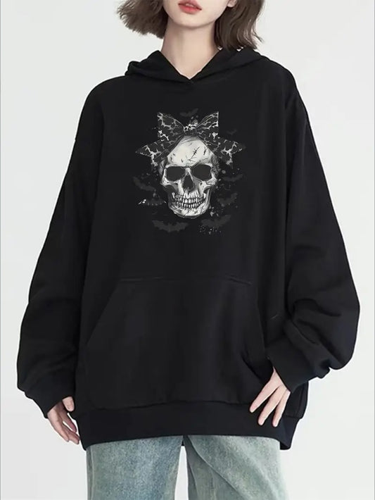 Black hoodie with skull design worn by a person on a white background