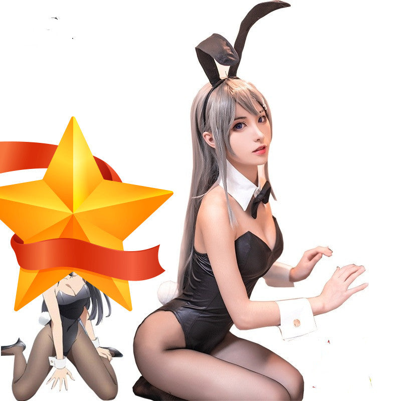 Person in a black outfit with bunny ears and a yellow star graphic on a white background