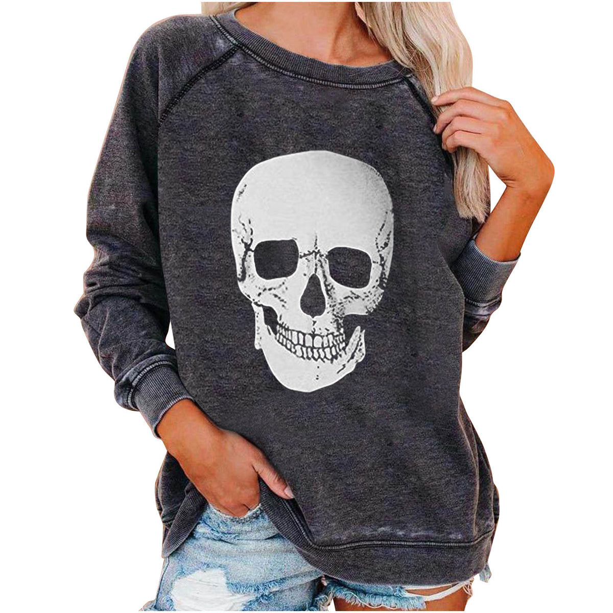 Dark gray sweatshirt with a skull design worn by a person on a white background