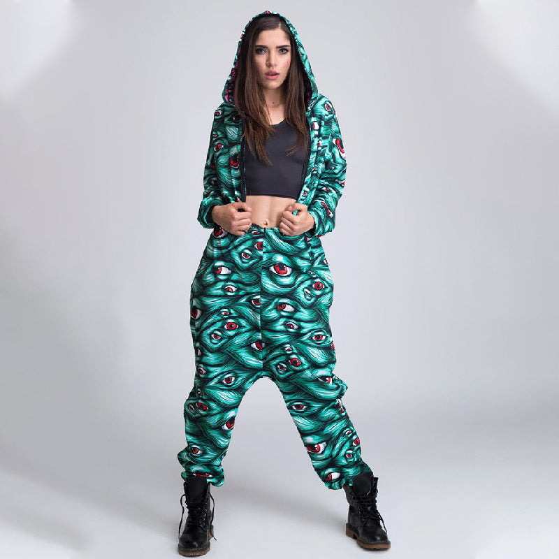 Person wearing a green patterned hoodie and pants set on a white background