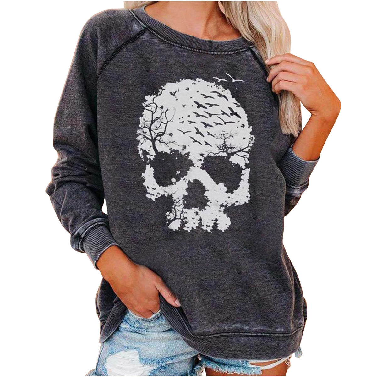 Dark gray sweatshirt with a white skull design worn by a person on a white background