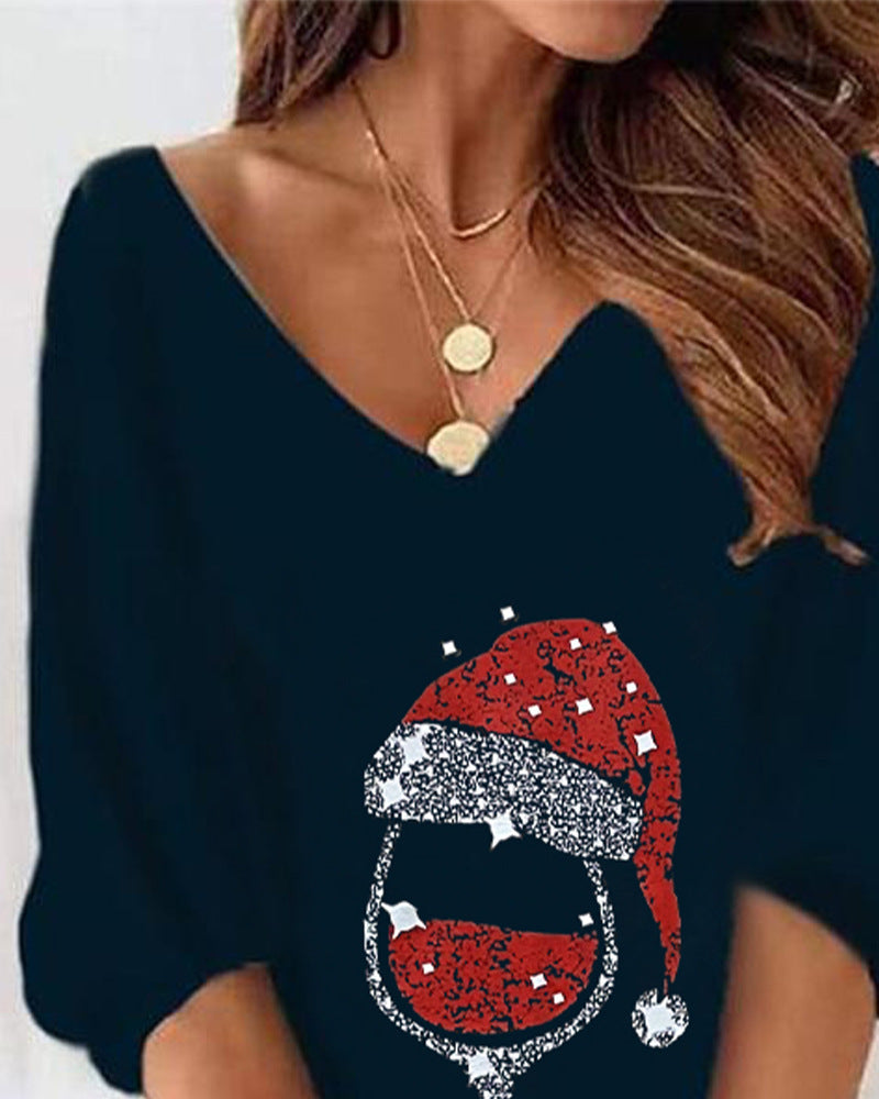 Navy blue sweater with a Santa hat design on a plain background