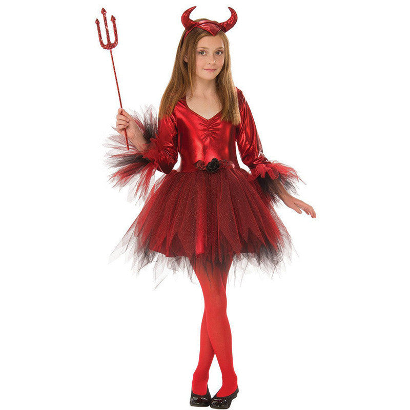 Child wearing a red devil costume with a black tutu, horns, and a red pitchfork on a white background.