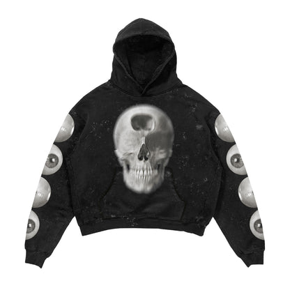 Black hoodie with skull design and eye pattern on sleeves against a white background