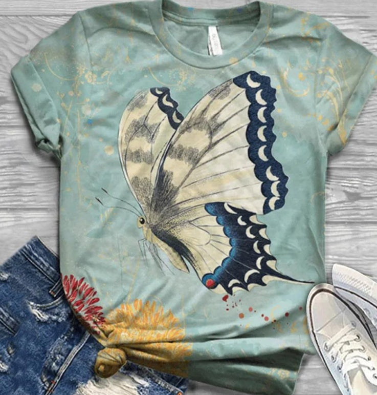 T-shirt with a butterfly design on a wooden surface